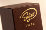 Suizz cognac packaging branding detail, styled photograph